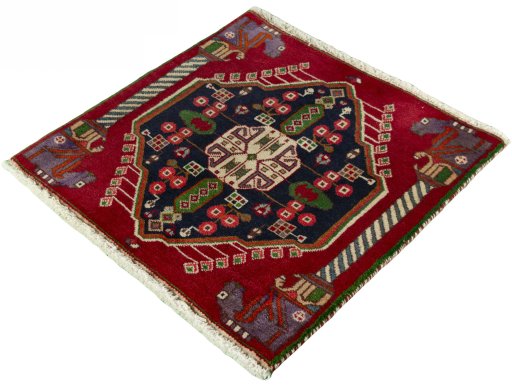 Corner detail of 2000s Shiraz rug showing border pattern and Wool pile