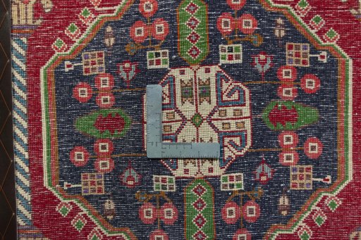 Backside of handmade 2000s Shiraz rug showing knot structure and weave density