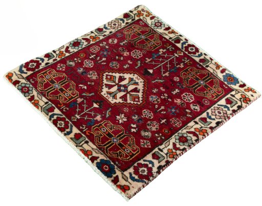 Corner detail of 2000s Shiraz rug showing border pattern and Wool pile