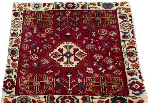 Surface texture of 2000s Shiraz rug with natural Wool and intricate pattern