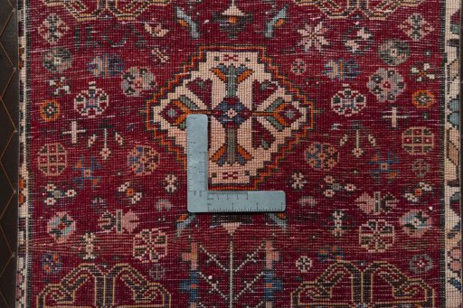 Backside of handmade 2000s Shiraz rug showing knot structure and weave density