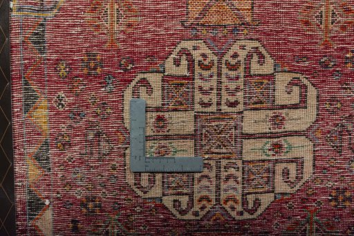 Backside of handmade 2000s Shiraz rug showing knot structure and weave density