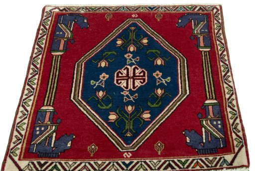 Surface texture of 2000s Shiraz rug with natural Wool and intricate pattern