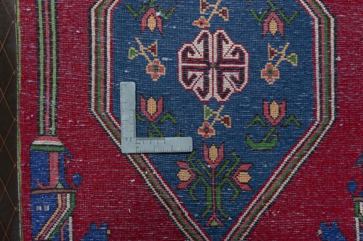 Backside of handmade 2000s Shiraz rug showing knot structure and weave density