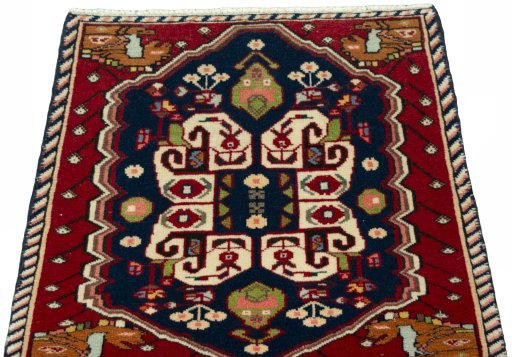 Surface texture of 2000s Shiraz rug with natural Wool and intricate pattern
