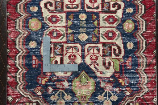 Backside of handmade 2000s Shiraz rug showing knot structure and weave density