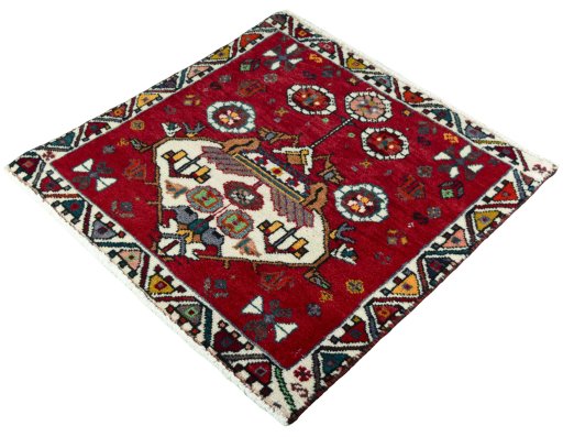 Corner detail of 2000s Shiraz rug showing border pattern and Wool pile