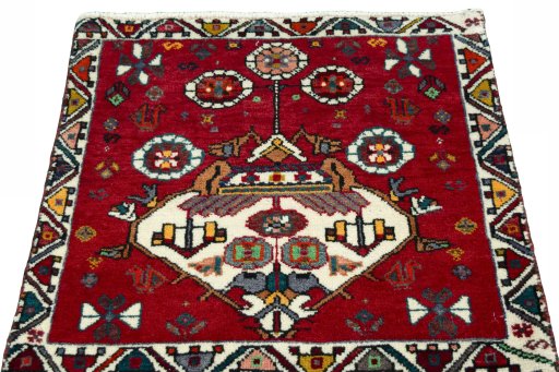 Surface texture of 2000s Shiraz rug with natural Wool and intricate pattern