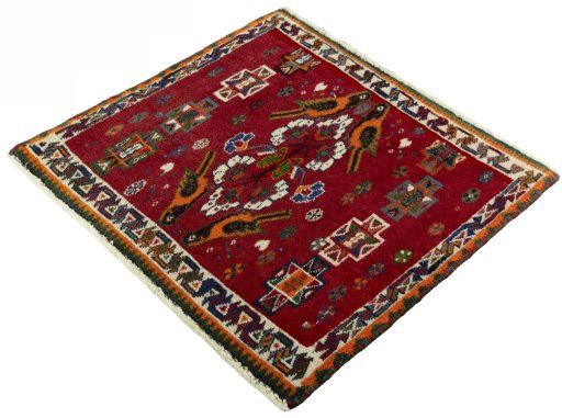 Corner detail of 2000s Shiraz rug showing border pattern and Wool pile