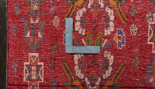 Backside of handmade 2000s Shiraz rug showing knot structure and weave density