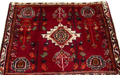 Surface texture of 2000s Shiraz rug with natural Wool and intricate pattern