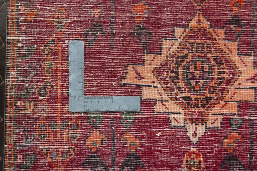 Backside of handmade 2000s Shiraz rug showing knot structure and weave density