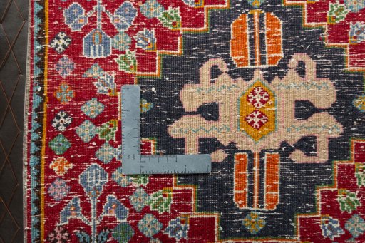 Backside of handmade 2000s Shiraz rug showing knot structure and weave density