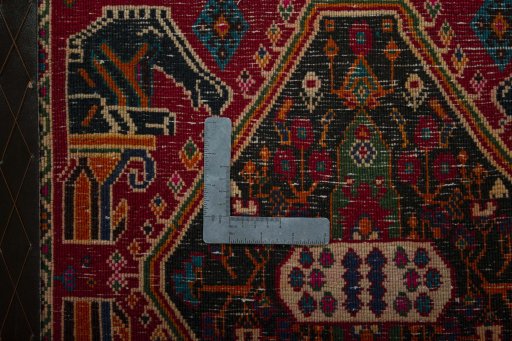 Backside of handmade 2000s Shiraz rug showing knot structure and weave density