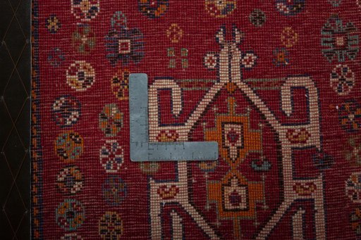 Backside of handmade 2000s Shiraz rug showing knot structure and weave density