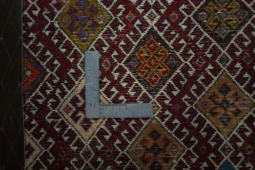 Backside of handmade 2000s Shiraz rug showing knot structure and weave density