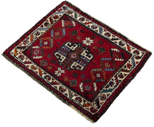 Corner detail of 2000s Shiraz rug showing border pattern and Wool pile