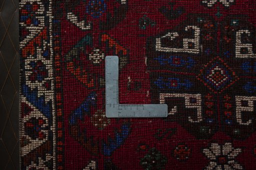 Backside of handmade 2000s Shiraz rug showing knot structure and weave density