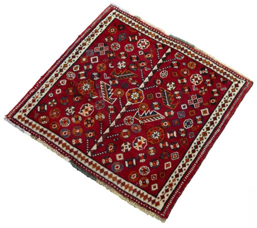 Corner detail of 2000s Shiraz rug showing border pattern and Wool pile
