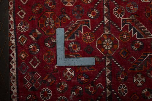 Backside of handmade 2000s Shiraz rug showing knot structure and weave density