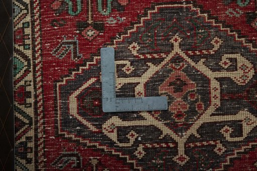 Backside of handmade 2000s Shiraz rug showing knot structure and weave density