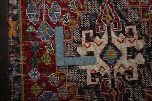 Backside of handmade 2000s Shiraz rug showing knot structure and weave density