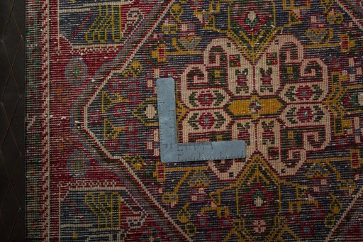 Backside of handmade 2000s Shiraz rug showing knot structure and weave density