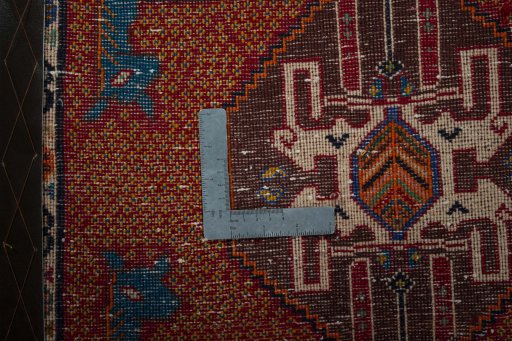 Backside of handmade 2000s Shiraz rug showing knot structure and weave density