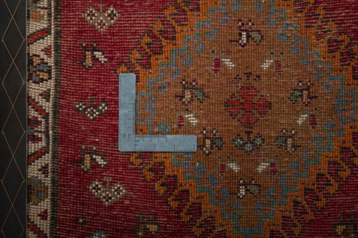 Backside of handmade 2000s Shiraz rug showing knot structure and weave density