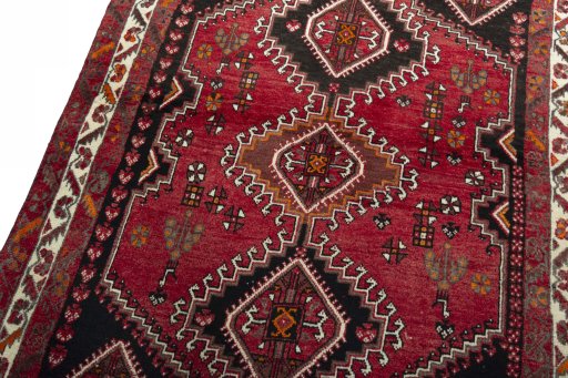 Backside of handmade 2000s Shiraz rug showing knot structure and weave density