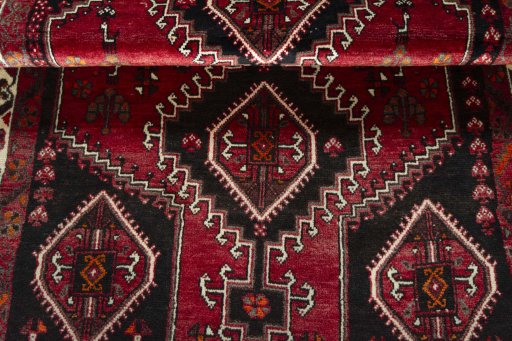 Full view of 2000s Shiraz rug from Iran / Persia, 170 × 115 cm in Red tones