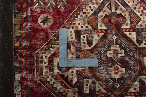 Backside of handmade 2000s Shiraz rug showing knot structure and weave density