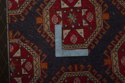 Backside of handmade 2000s Shiraz rug showing knot structure and weave density