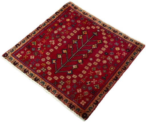 Corner detail of 2000s Shiraz rug showing border pattern and Wool pile