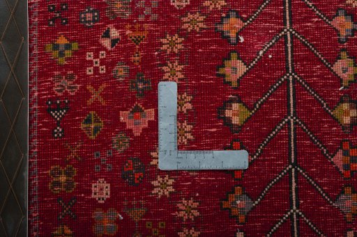 Backside of handmade 2000s Shiraz rug showing knot structure and weave density