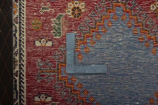 Backside of handmade 2000s Shiraz rug showing knot structure and weave density