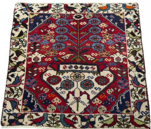 Surface texture of 2000s Shiraz rug with natural Wool and intricate pattern