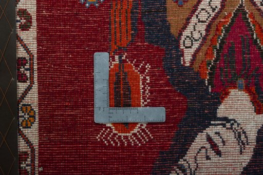 Backside of handmade 2000s Shiraz rug showing knot structure and weave density