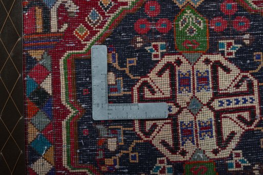 Backside of handmade 2000s Shiraz rug showing knot structure and weave density
