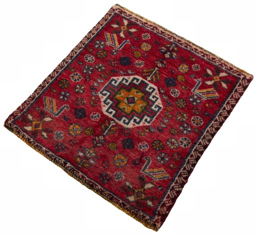 Corner detail of 2000s Shiraz rug showing border pattern and Wool pile