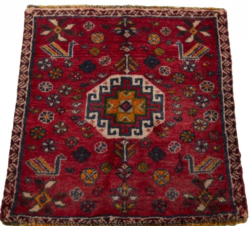 Surface texture of 2000s Shiraz rug with natural Wool and intricate pattern