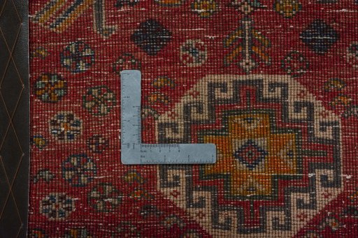 Backside of handmade 2000s Shiraz rug showing knot structure and weave density