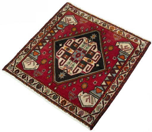 Corner detail of 2000s Shiraz rug showing border pattern and Wool pile
