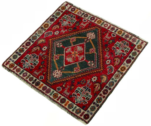 Corner detail of 2000s Shiraz rug showing border pattern and Wool pile