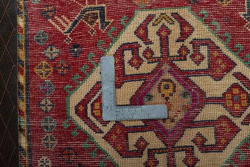 Backside of handmade 2000s Shiraz rug showing knot structure and weave density