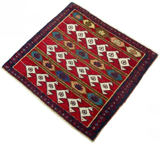 Corner detail of 2000s Shiraz rug showing border pattern and Wool pile