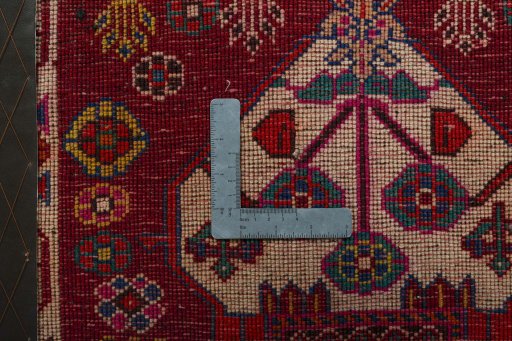 Backside of handmade 2000s Shiraz rug showing knot structure and weave density