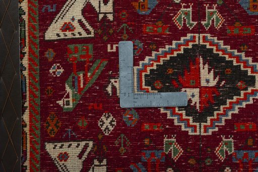 Backside of handmade 2000s Shiraz rug showing knot structure and weave density