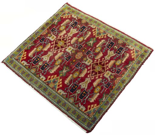 Corner detail of 2000s Shiraz rug showing border pattern and Wool pile