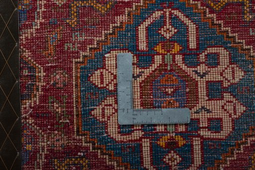 Backside of handmade 2000s Shiraz rug showing knot structure and weave density